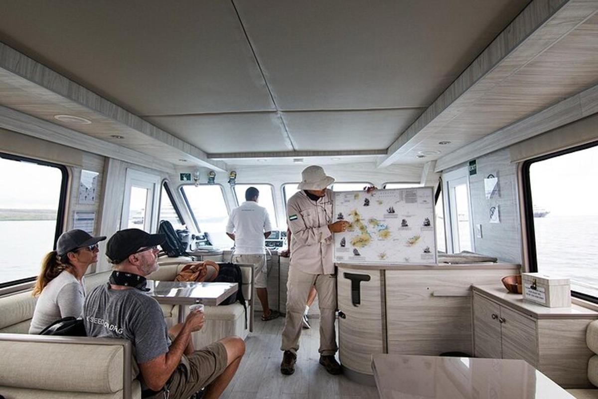 a group of people sitting in the inside of a boat