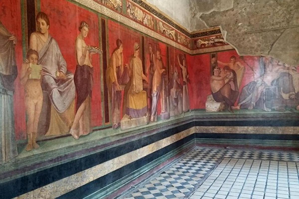 a room with a painting on the wall in a building