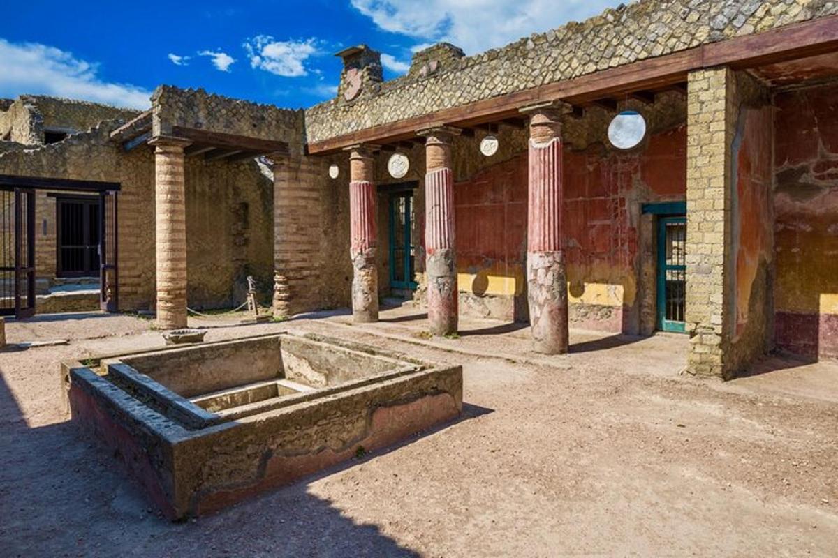 an old building with a fountain in a courtyard