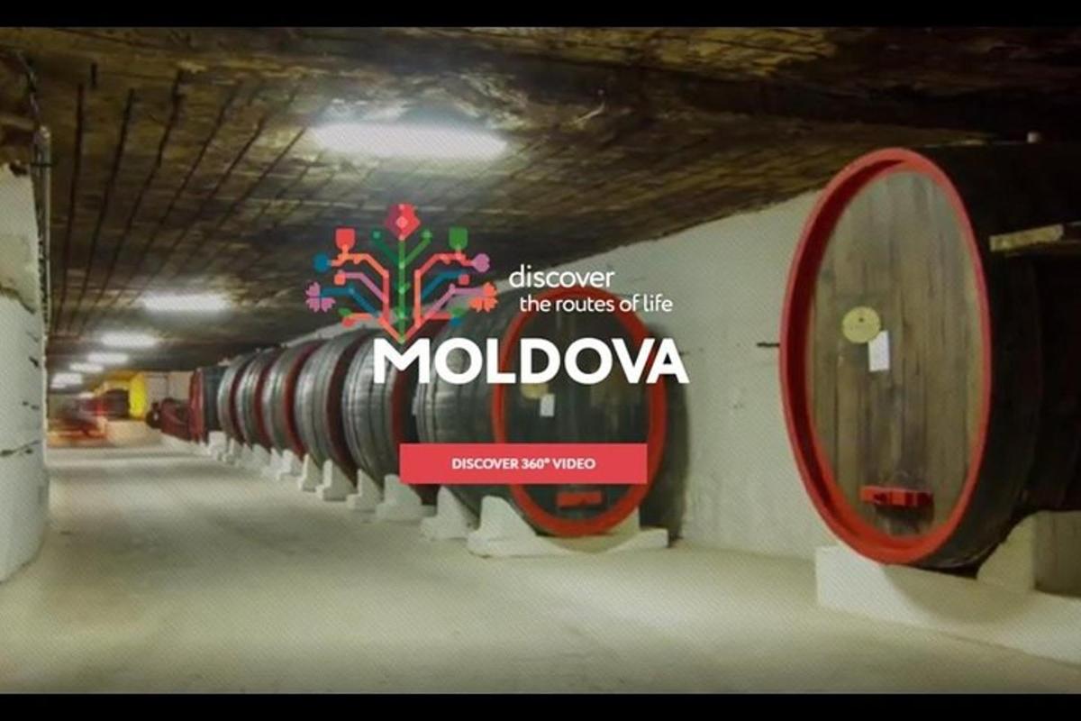 a row of wine barrels in a tunnel