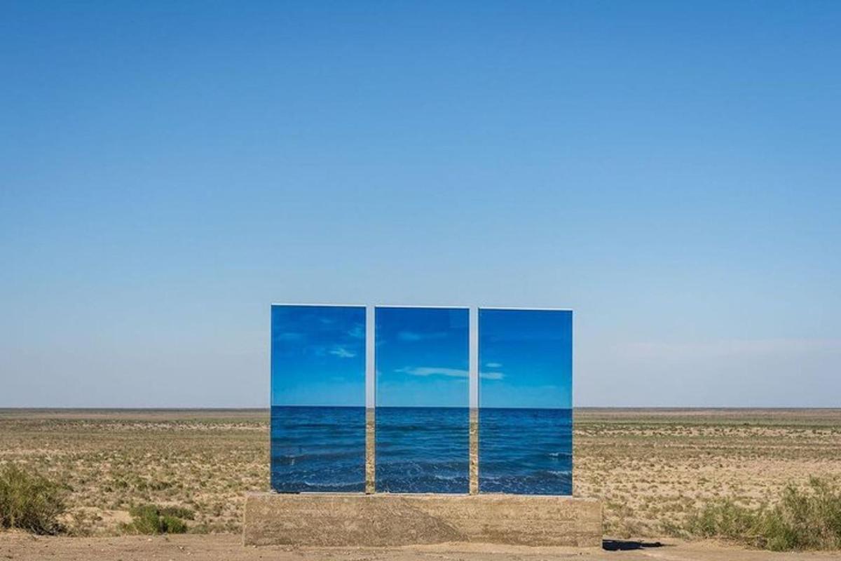 a glass box in the middle of the desert
