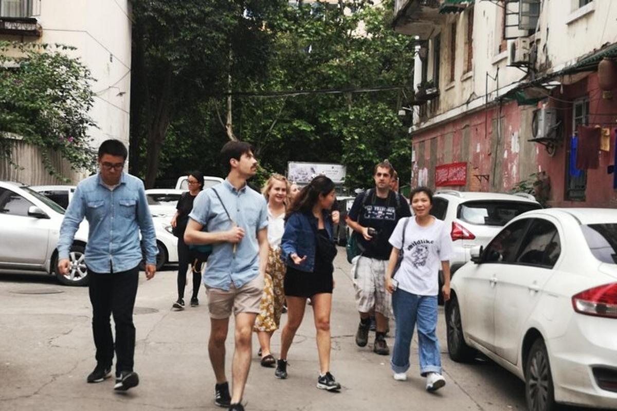 a group of people walking down a city street