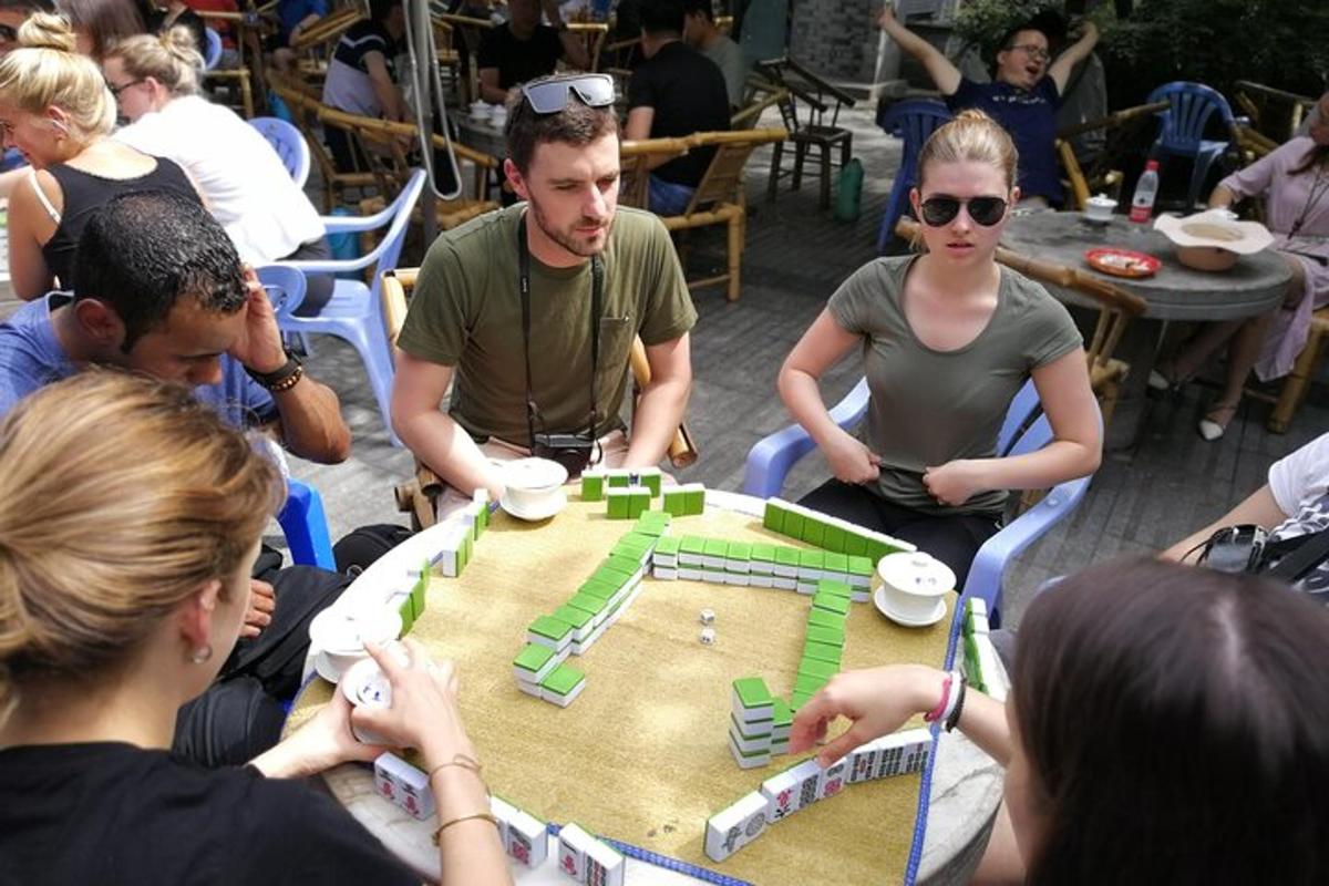a group of people sitting around a table playing a game