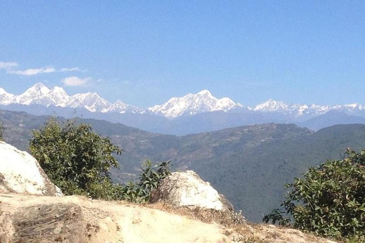 a view of a mountain range with snow capped mountains