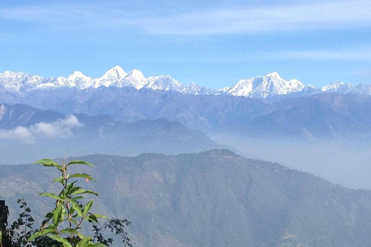 a view of a mountain range with snow covered mountains