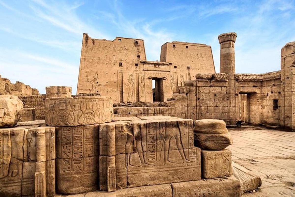 an ancient building with reliefs on the side of it