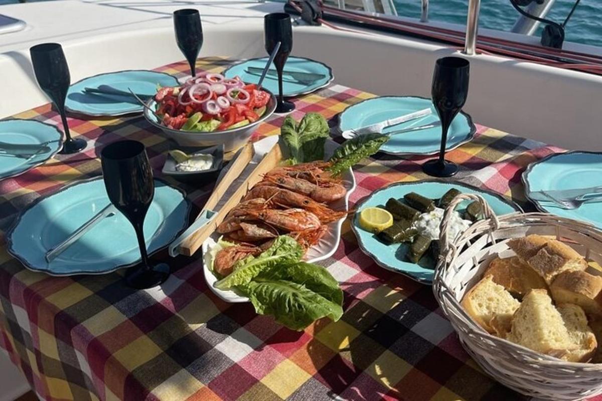 a table topped with plates of food on a boat