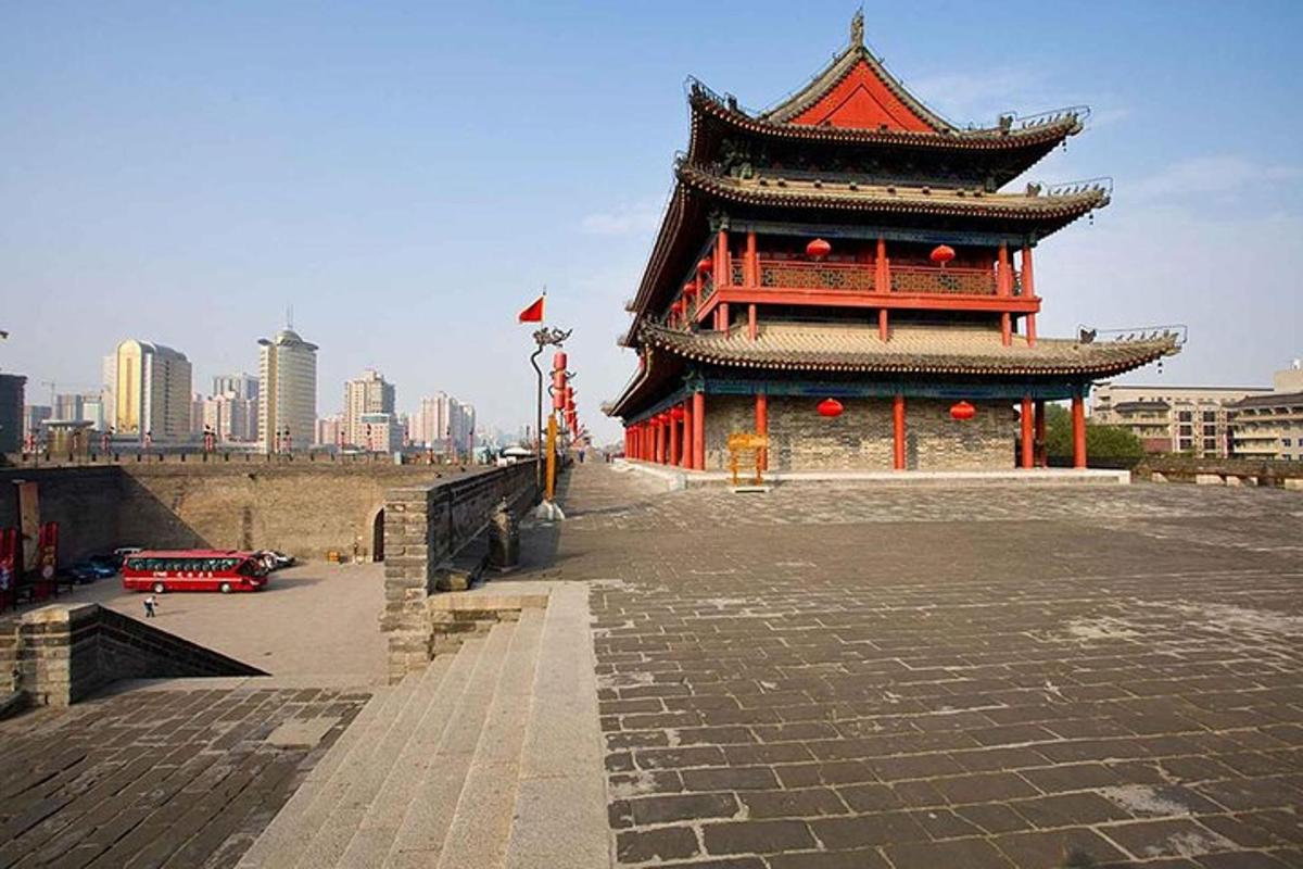 a pagoda with a building in the middle of a city