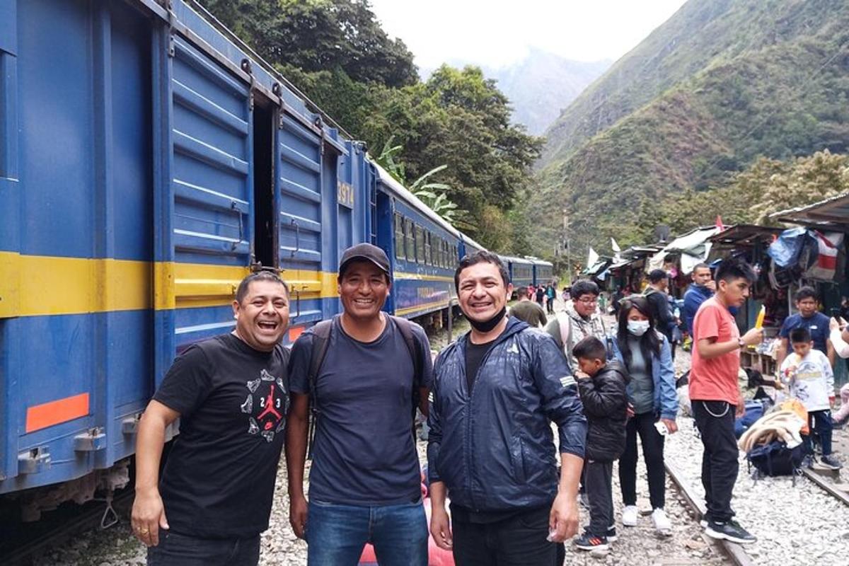 a group of men standing next to a train