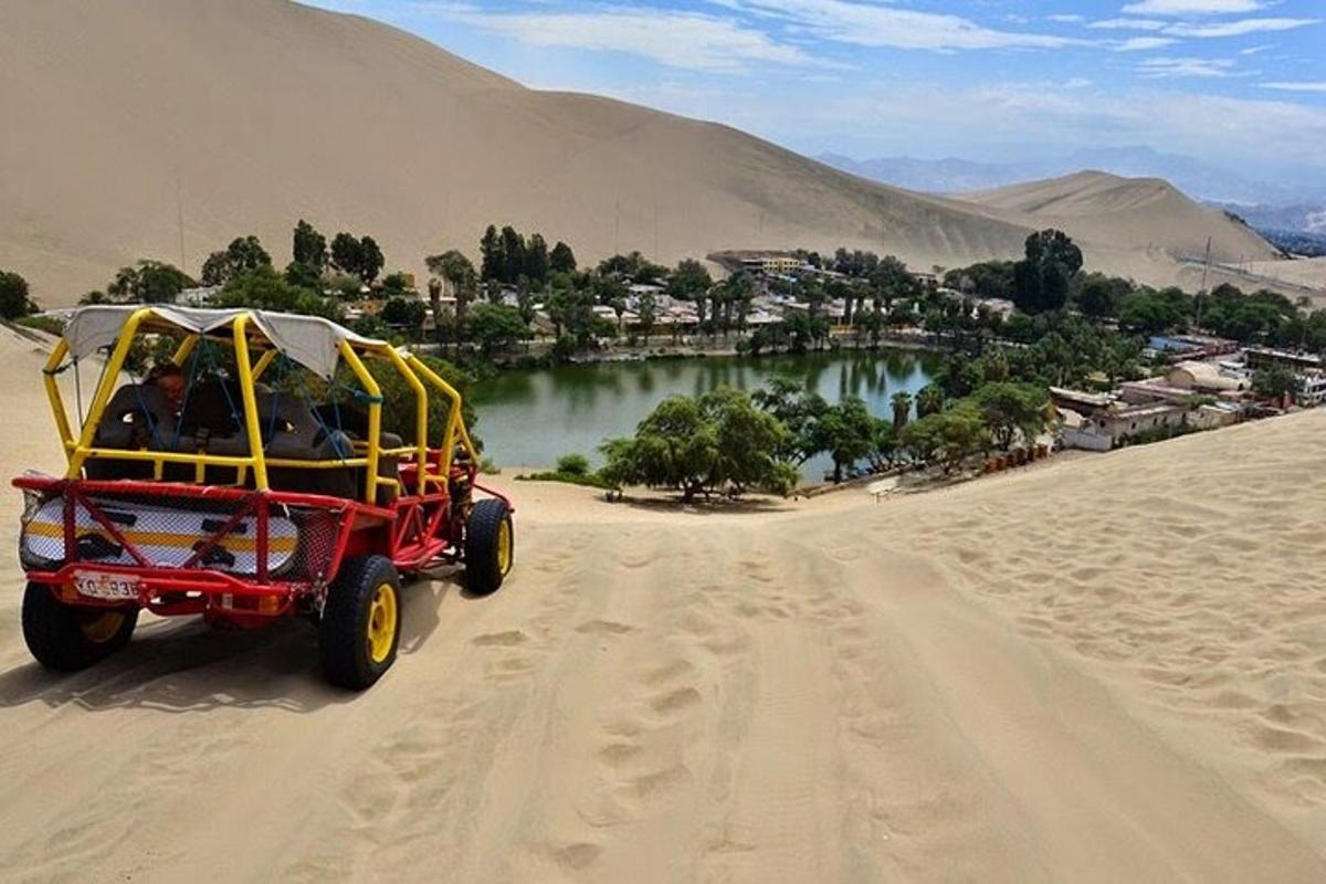 a red and yellow cart driving through the desert