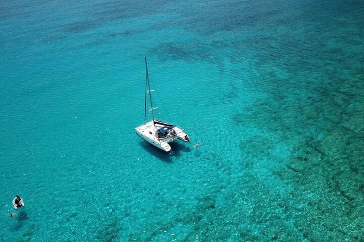 a boat in the water with a person in the ocean