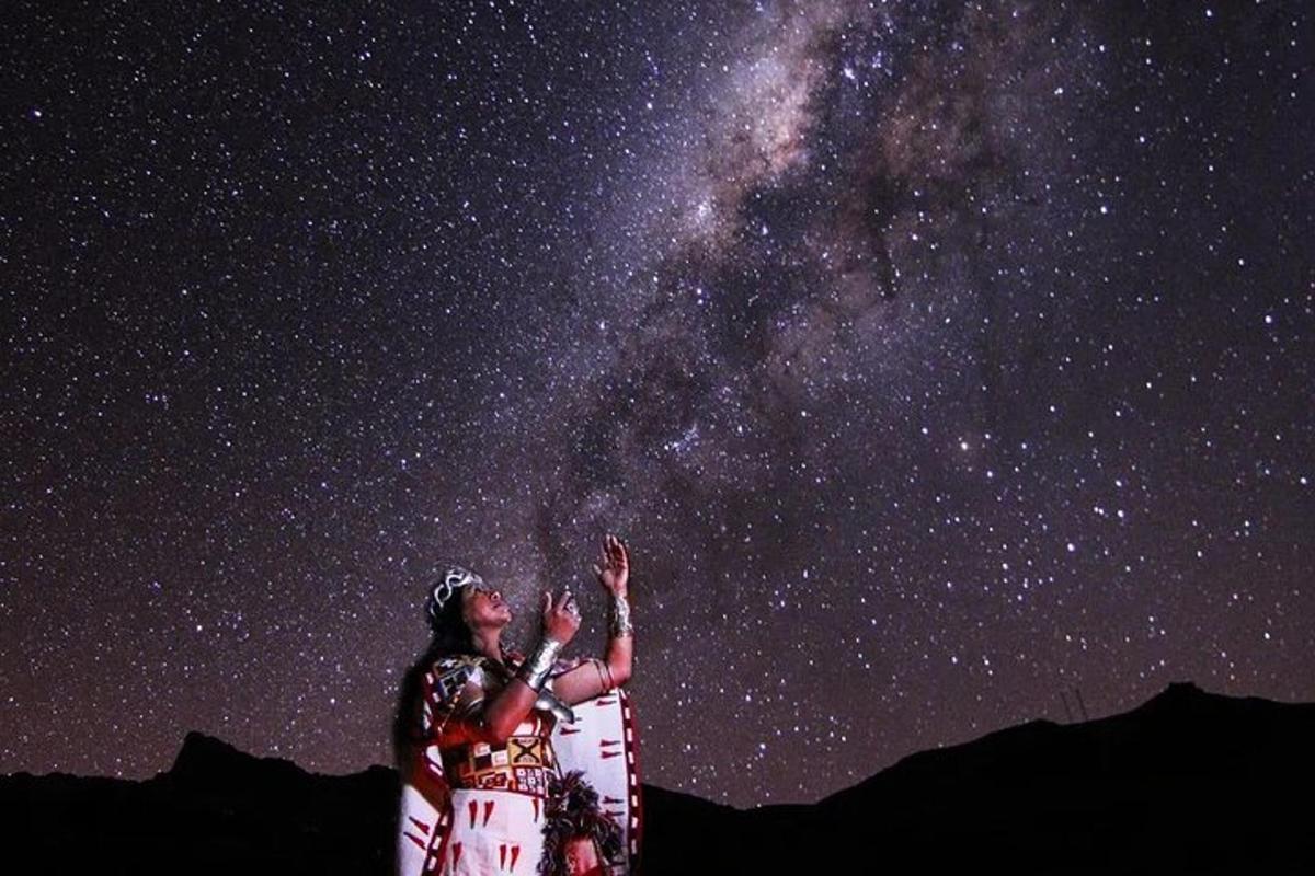 two people looking up at the night sky