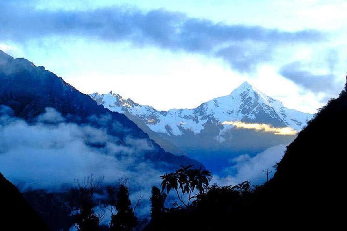 a view of a snow covered mountain in the distance