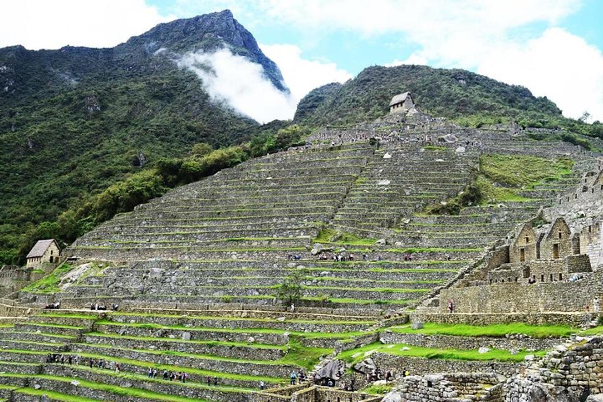 an ancient amphitheater with a mountain in the background
