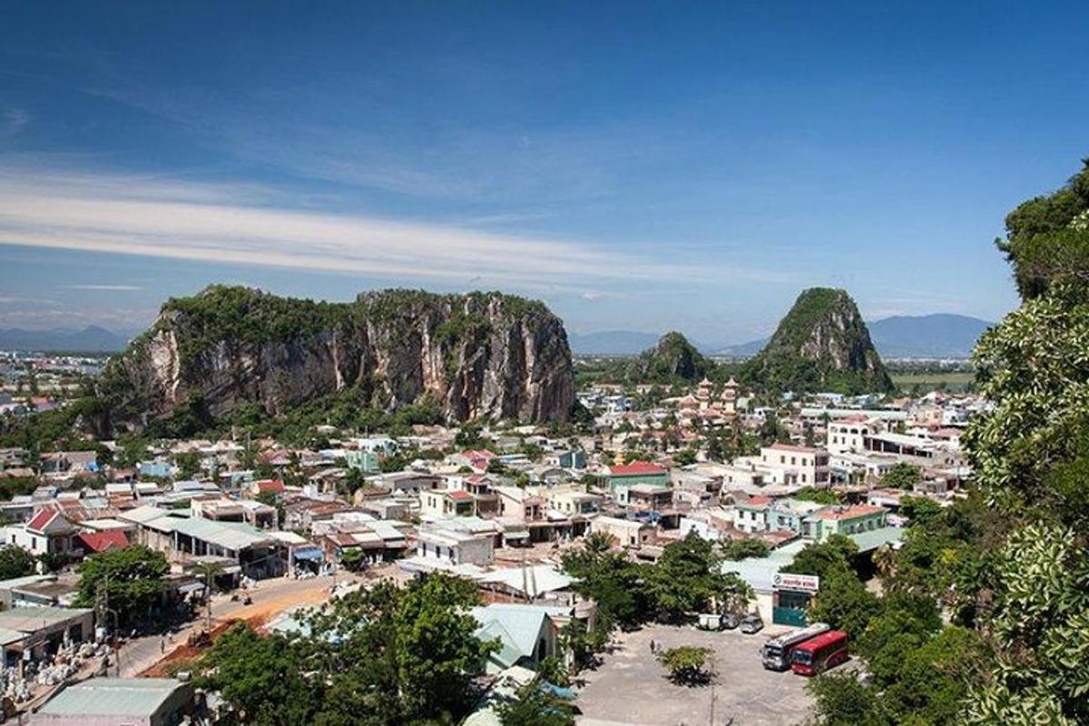 a small town with a mountain in the background