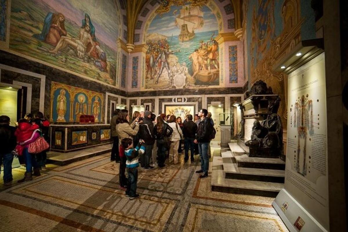 a group of people in a museum with paintings on the walls