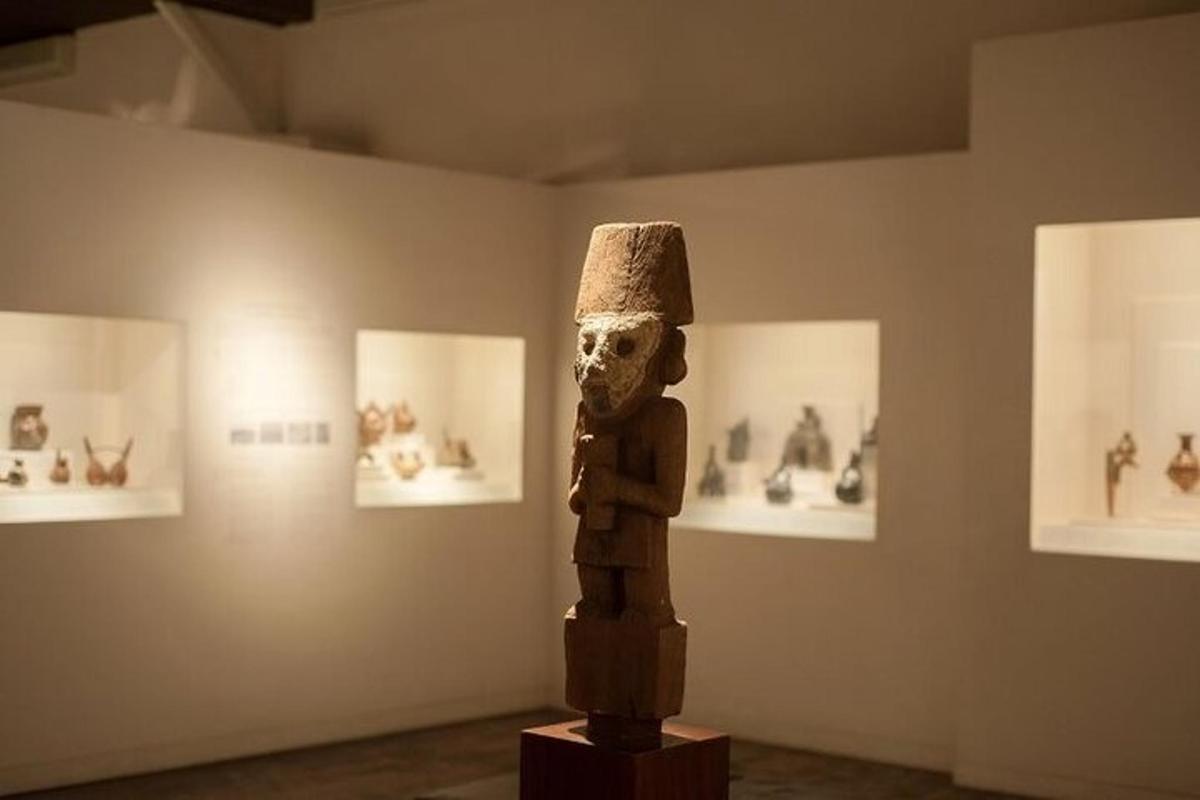 a statue in a museum withstatues on display