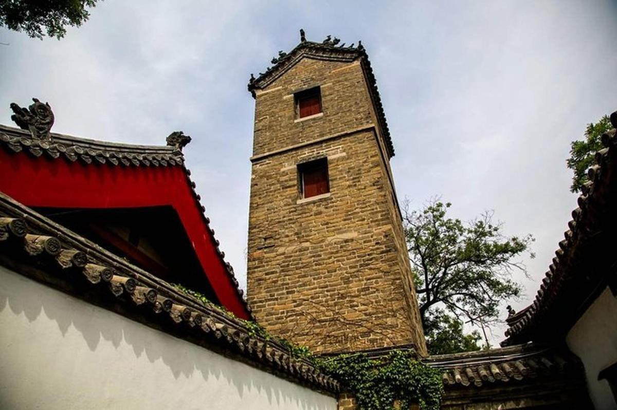 a tall brick tower on top of a building