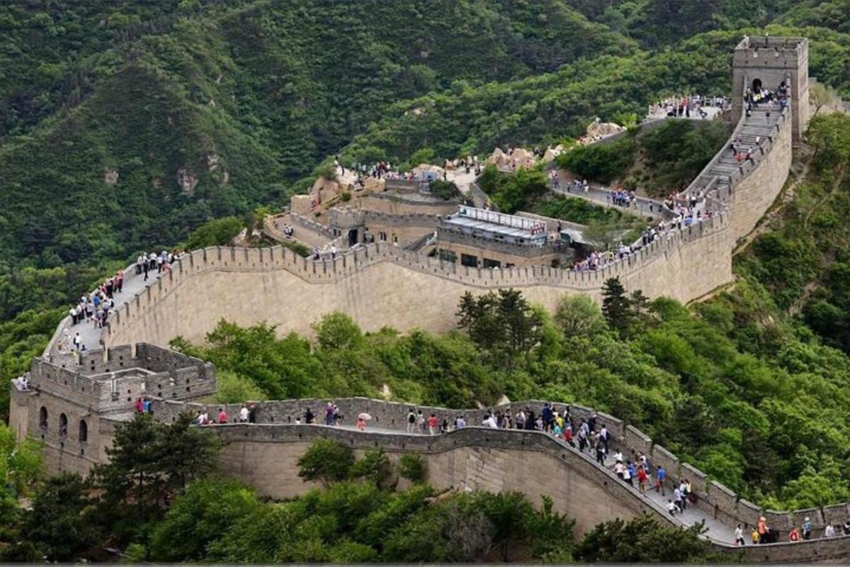 a group of people walking on the great wall