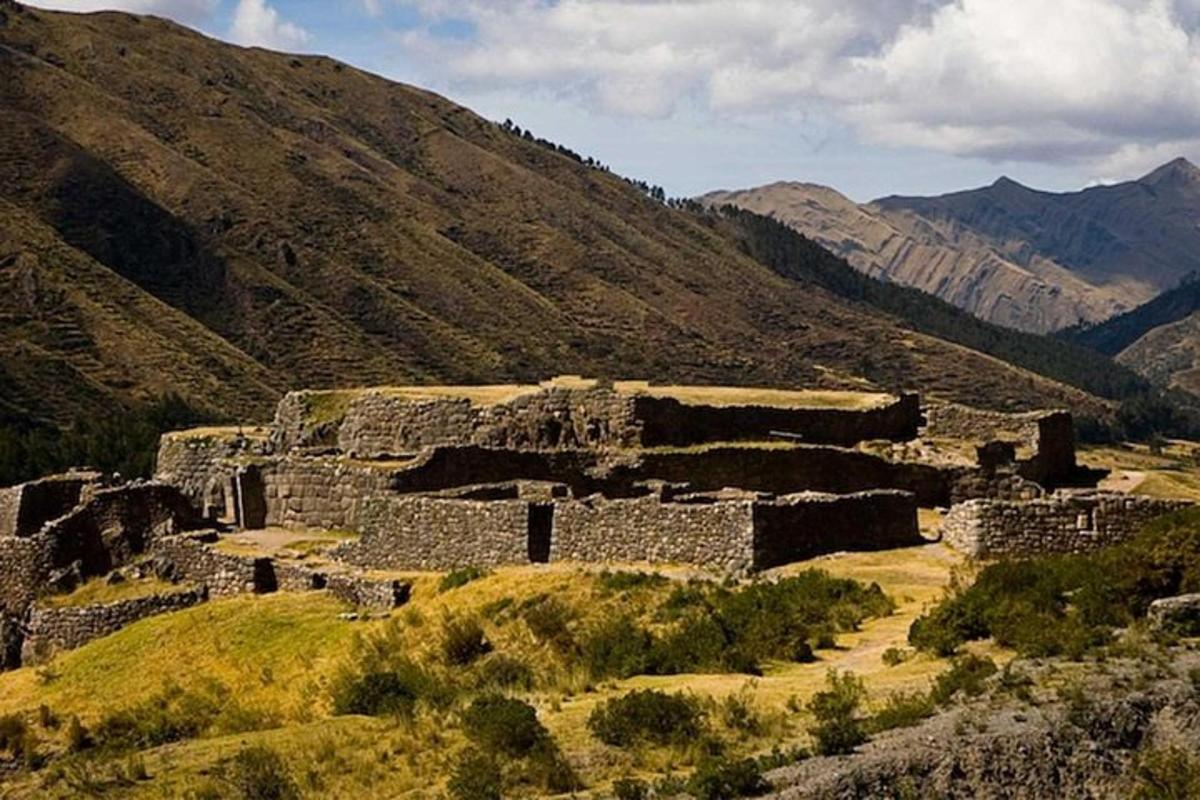 an ancient amphitheater in the mountains with mountains
