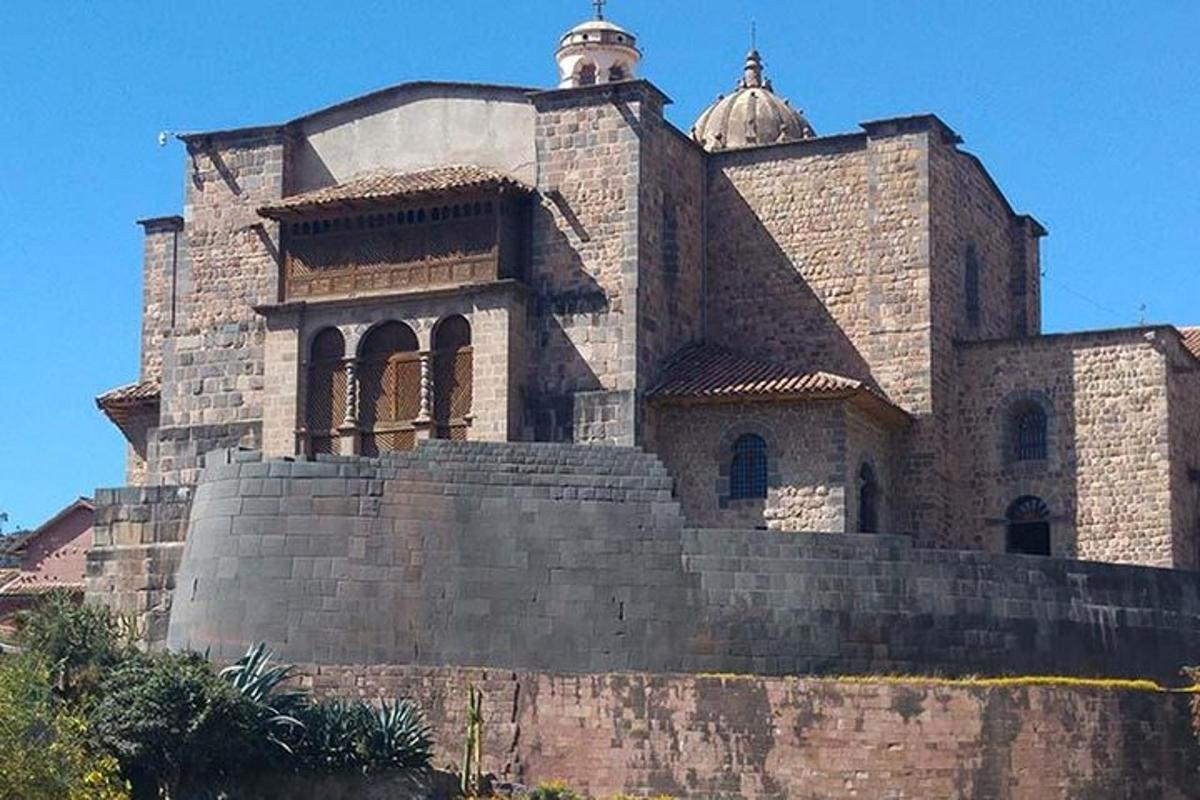 a large building on top of a stone wall