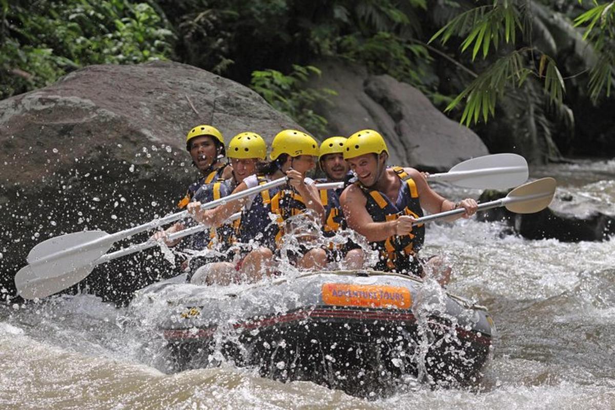 a group of people in a raft in the water
