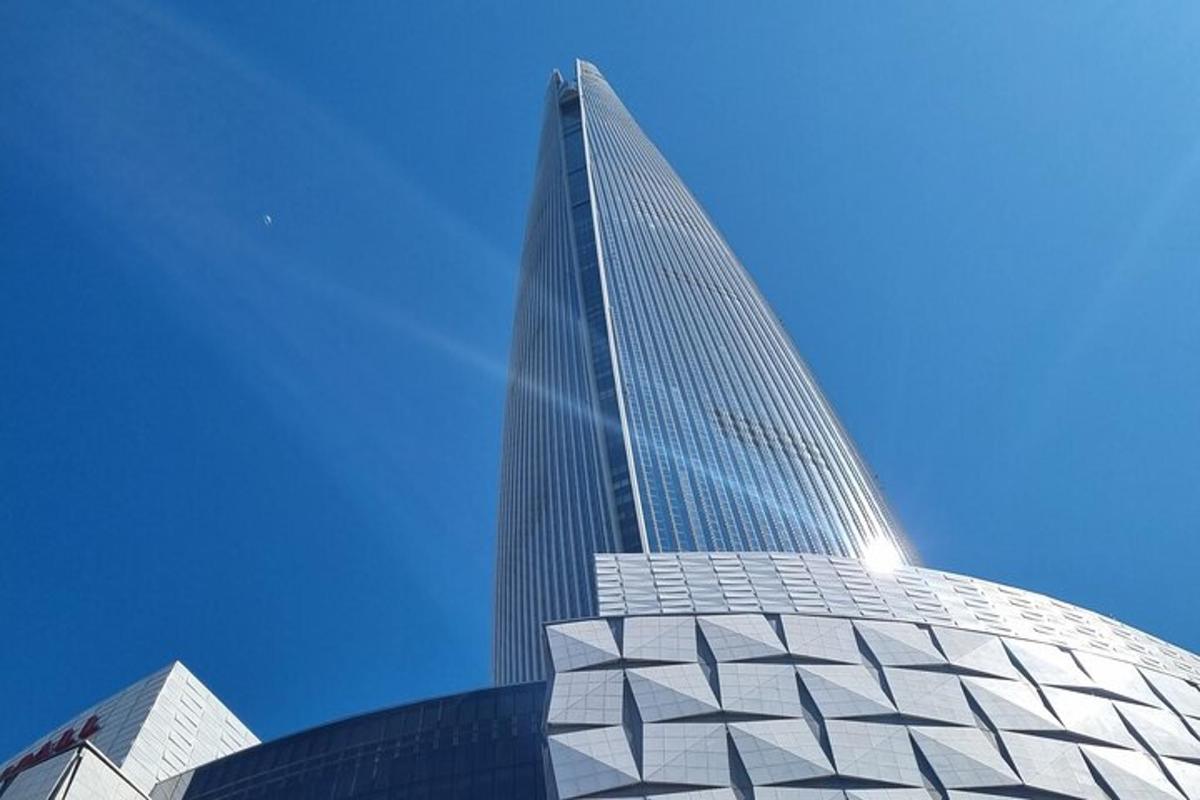 a tall building with a blue sky in the background