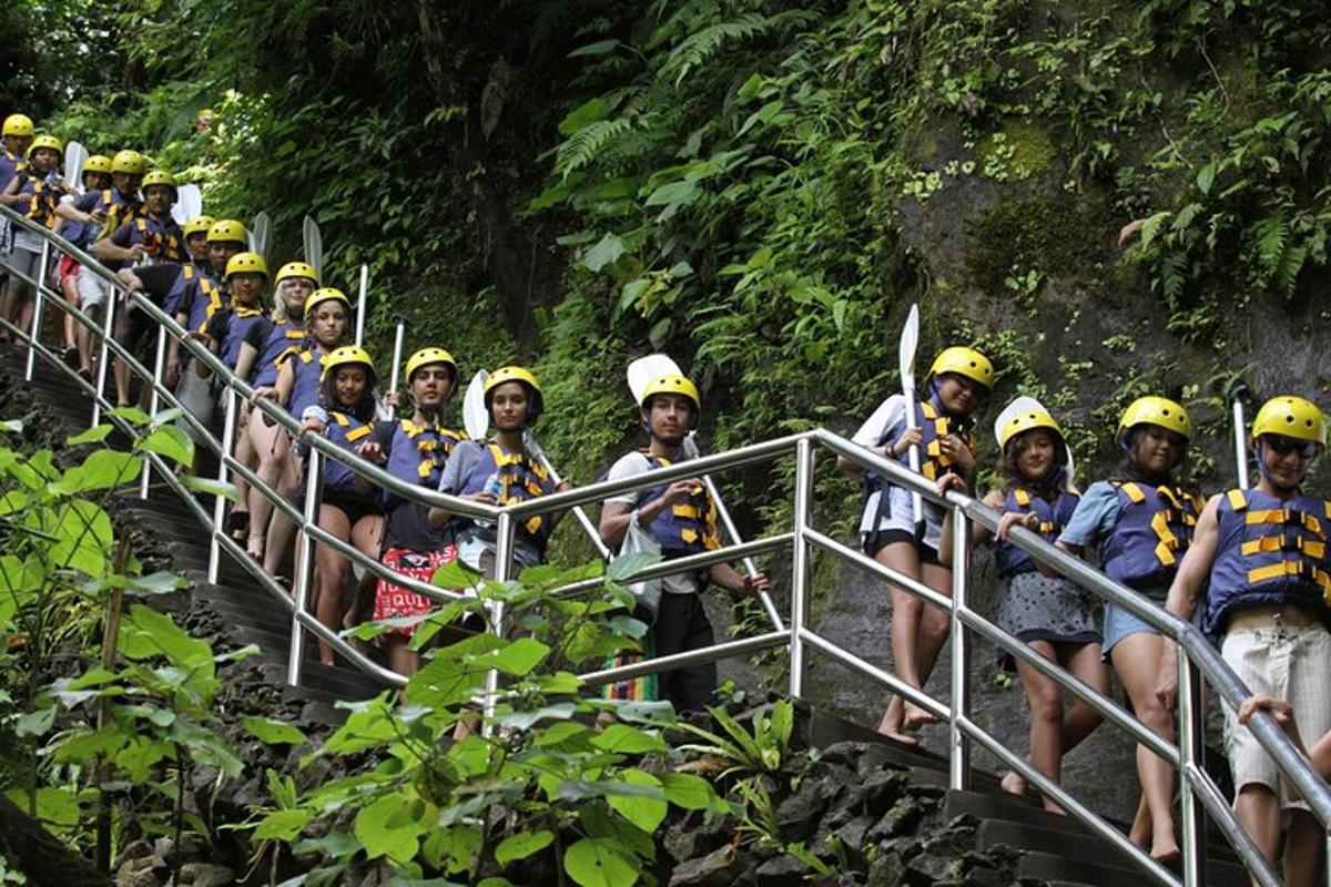 a group of people wearing yellow helmets on a bridge