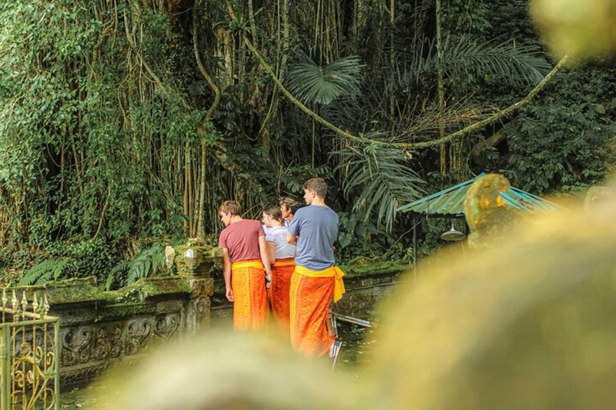 a group of people standing in front of a forest