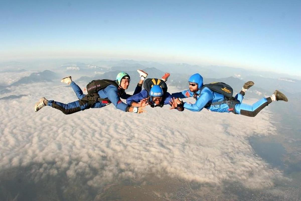 a group of people laying on top of the clouds