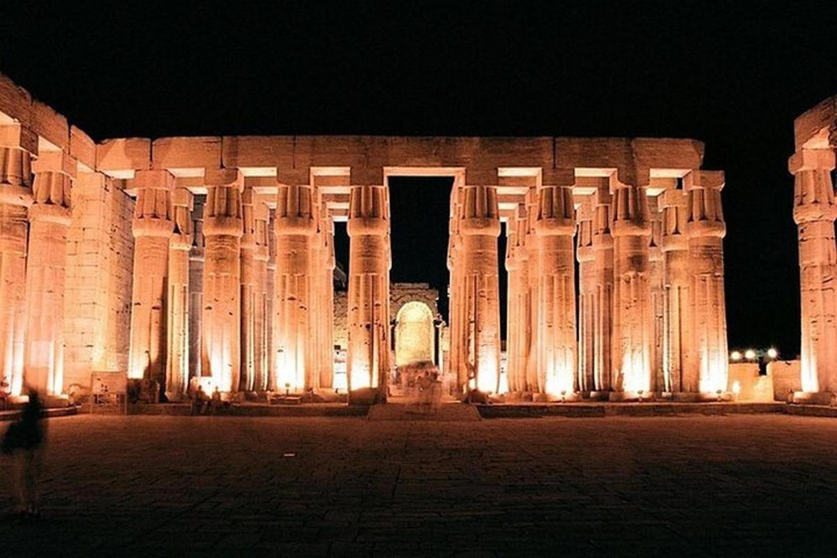a large building with columns at night