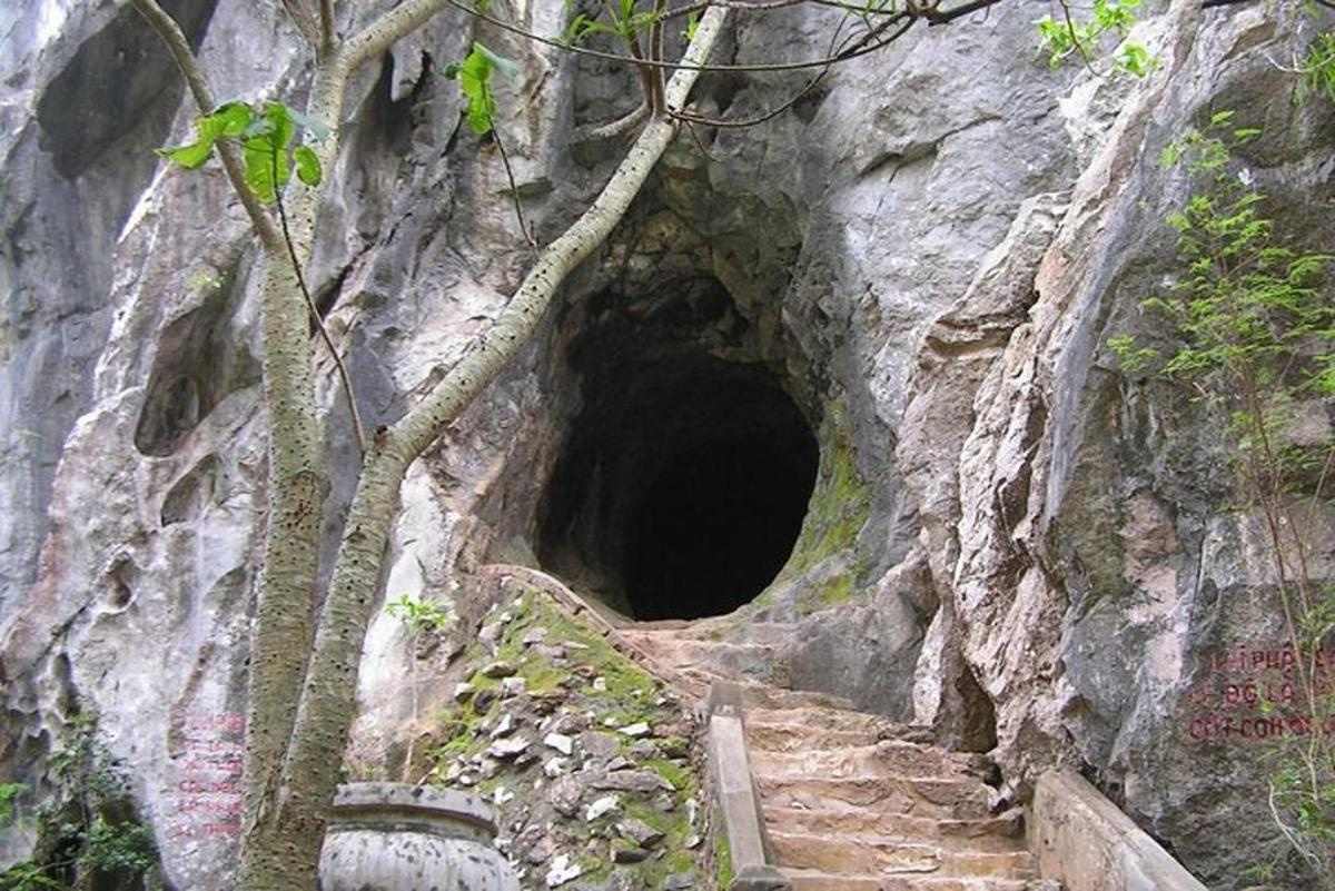 a tunnel in the side of a mountain with stairs