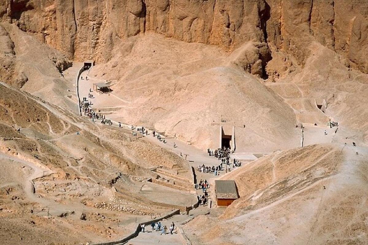 a group of people walking down a mountain