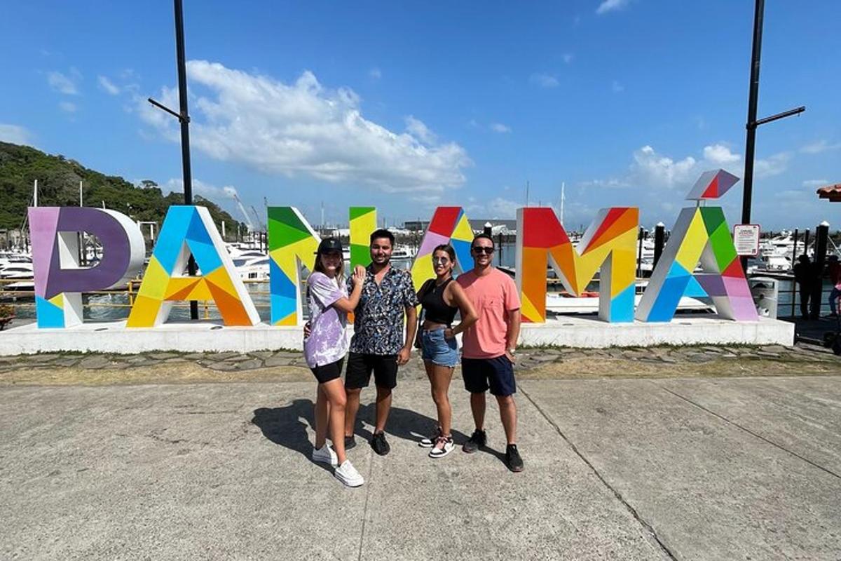 a group of people standing in front of a sign