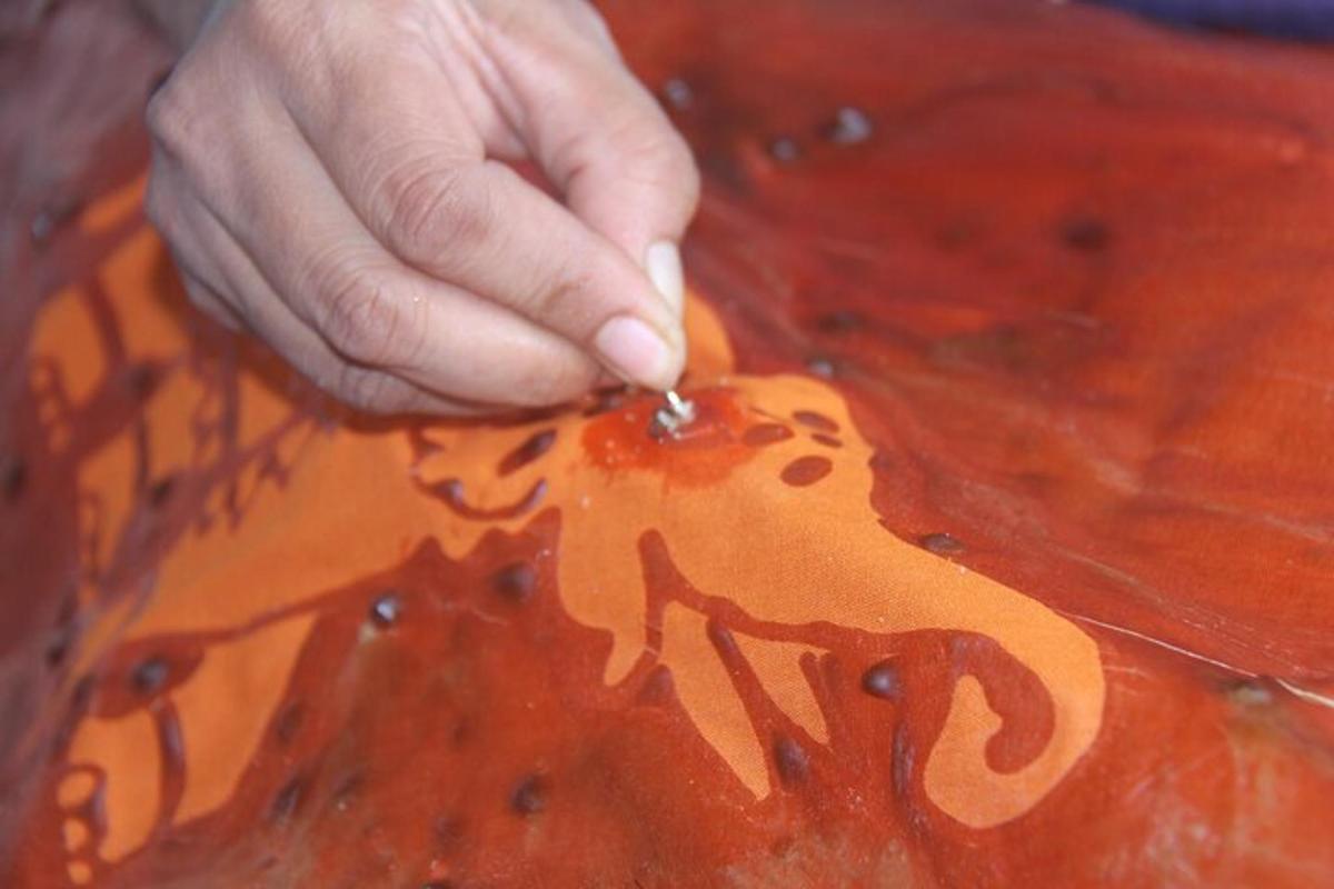 a person painting a picture of a tiger on a table