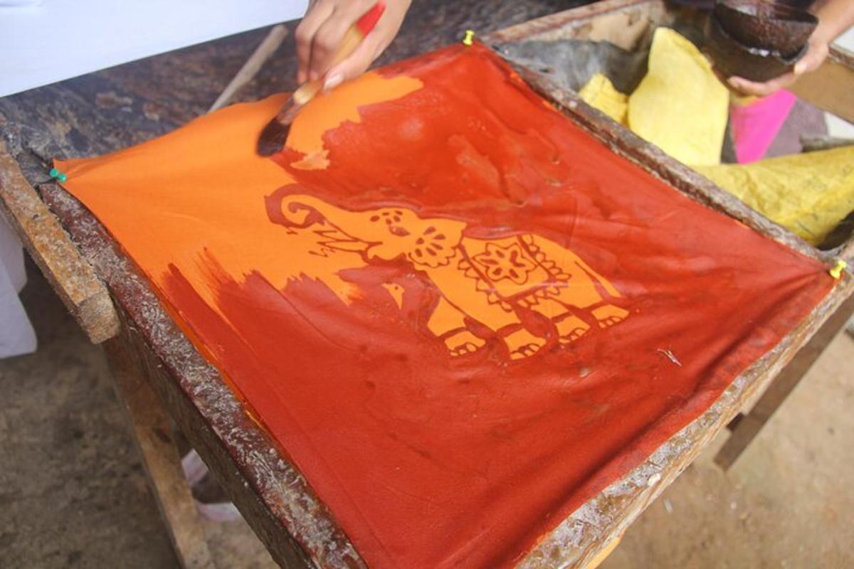 a person is cutting a kite with a knife