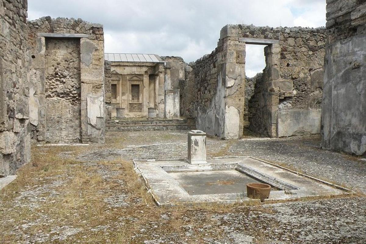 an old building with a stone courtyard with a mortar