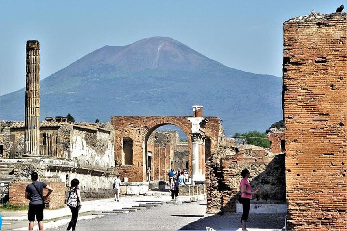 a group of people walking through the ruins of a building