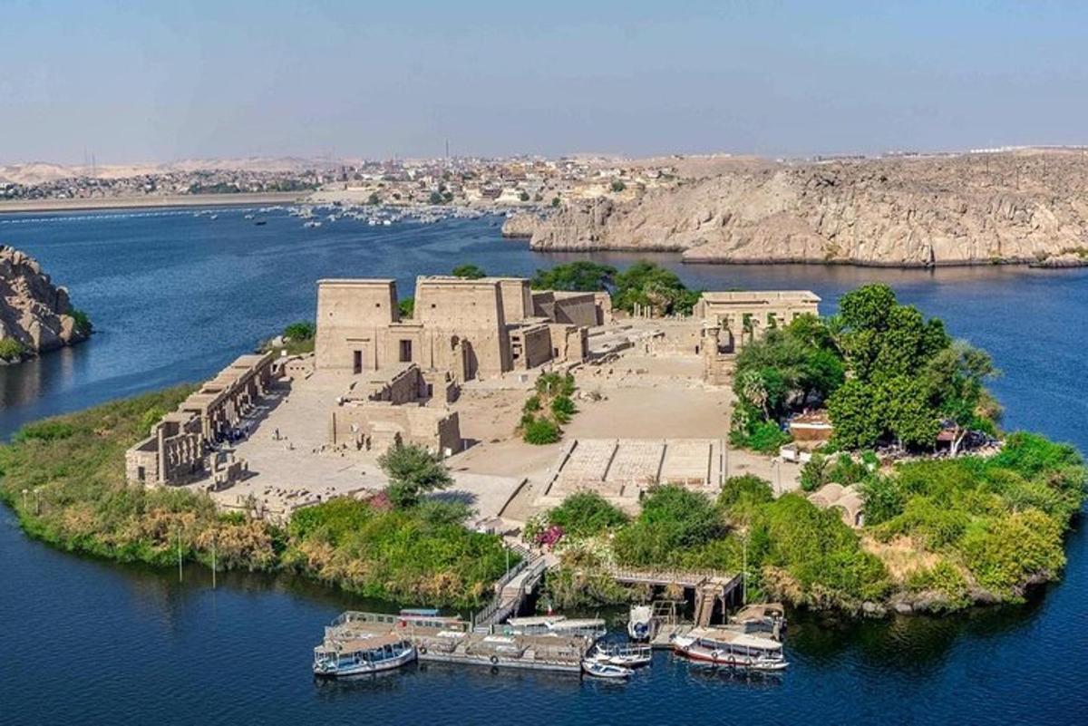 an island in the middle of a river with boats