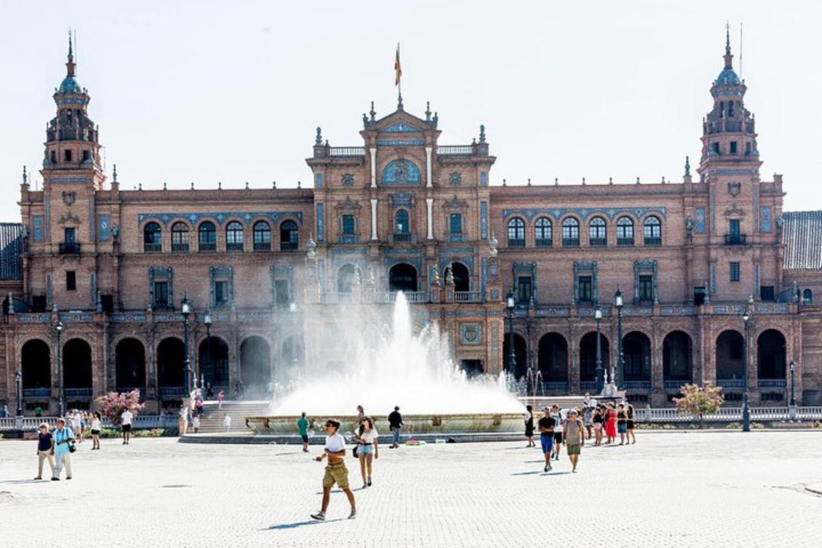 a large building with a fountain in front of it