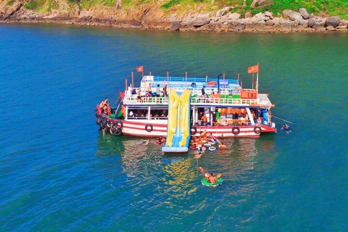 a group of people on a boat in the water