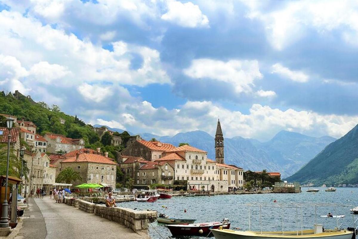 a view of a town with boats in the water