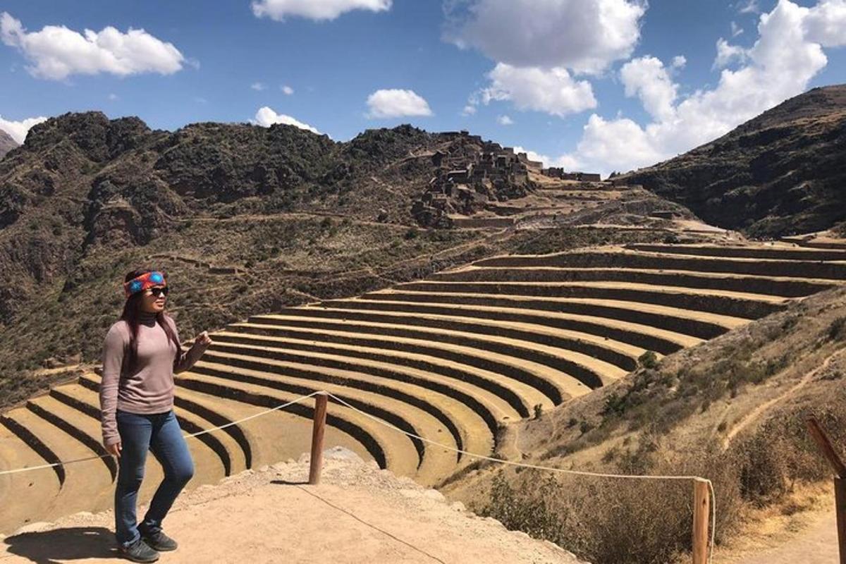 a woman standing on the steps of a amphitheater