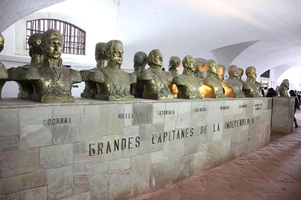 a group of statues of people on a wall