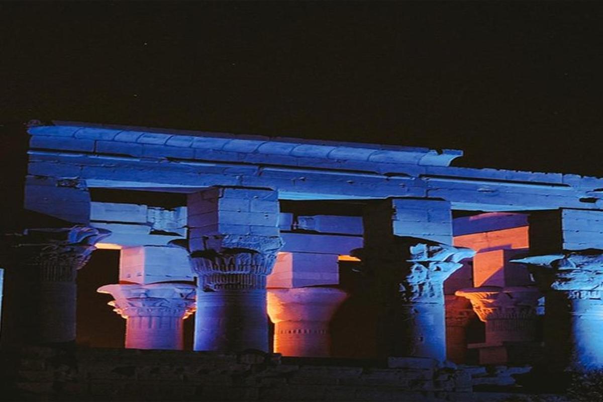 a building is lit up in blue and purple