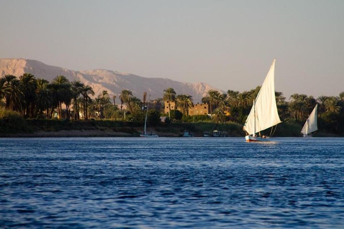 two boats on the water with mountains in the background
