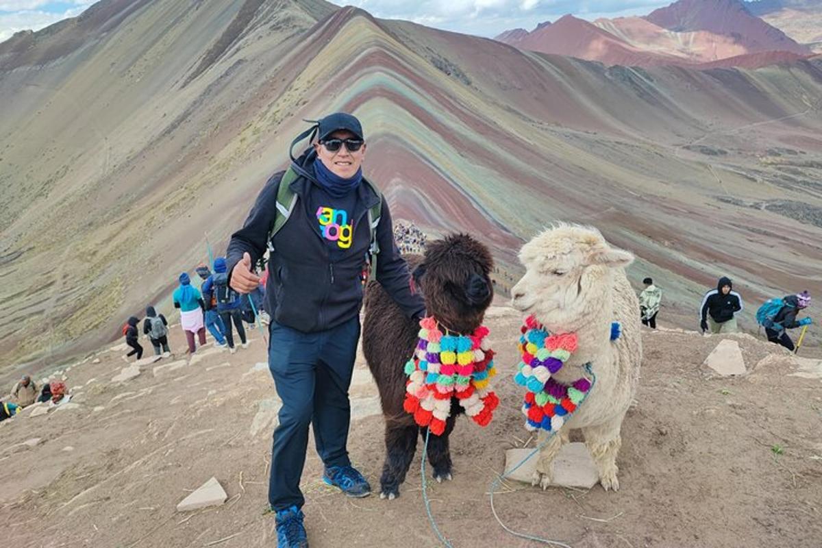 a man standing next to a stuffed animal and a sheep
