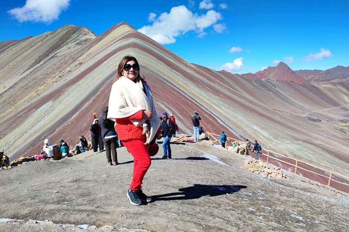 a woman standing on top of a mountain