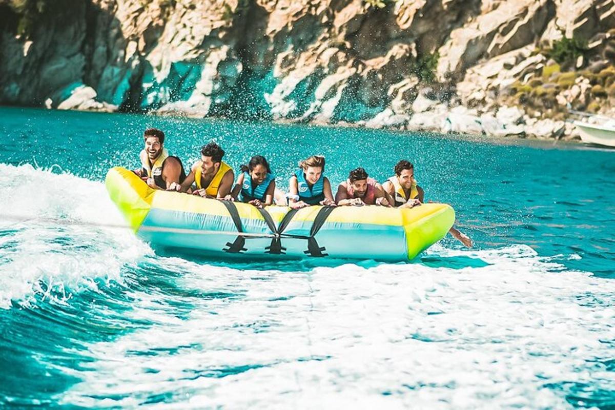 a group of children on a raft in the water