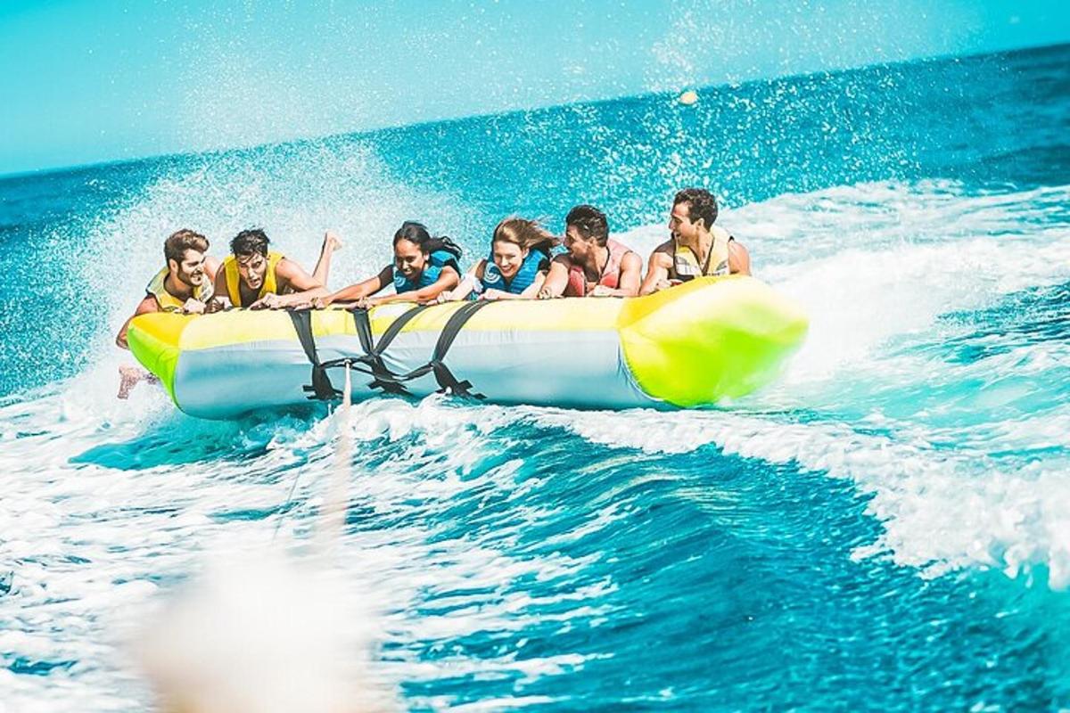 a group of people riding on a raft in the water